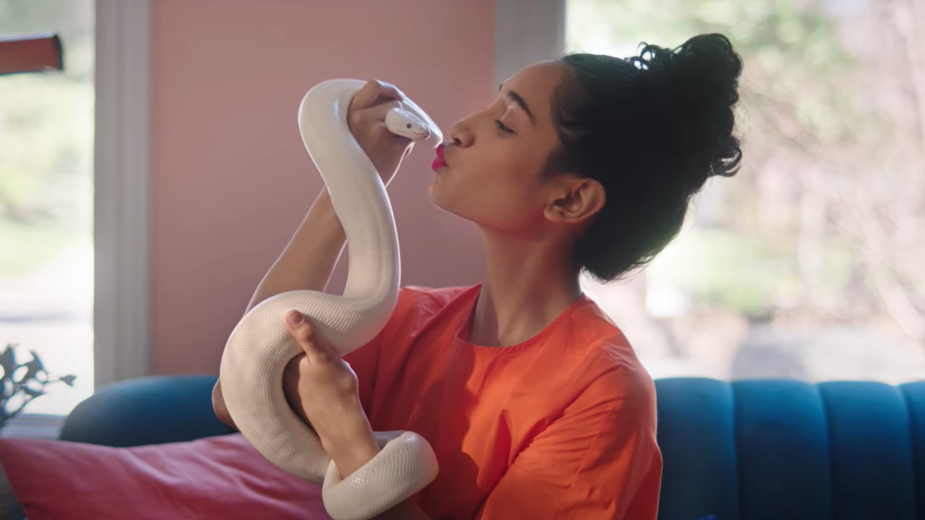woman kissing snake in petsmart hands on exotic campaign